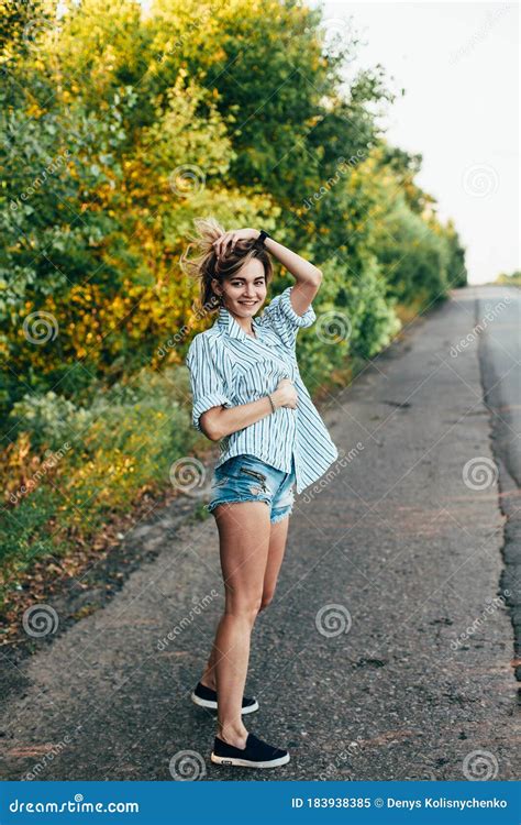 beautiful girl hitchhiking on the track in a man`s shirt stock image image of gesture slim