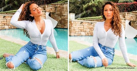 Adrienne Bailon Looks Blooming Lovely In White Top And Ripped Jeans In