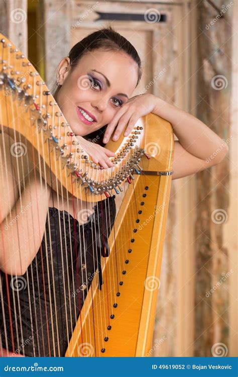 Woman Playing The Harp Instrument Stock Photo Image Of Door Clothing