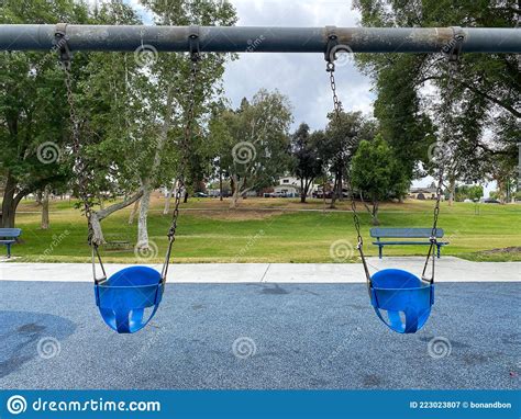 Swings At Children Playground Activities In Public Park Stock Image