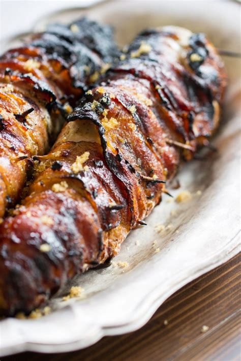 Season with fresh cracked black pepper and overlay with thyme. Bacon-Wrapped Pork Tenderloin Recipe with Garlic & Brown Sugar