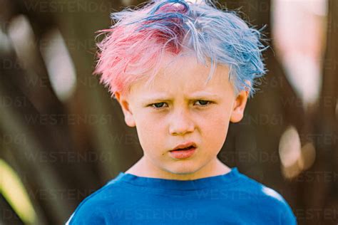 Young Boy With Colored Hair Glaring At Camera Stock Photo