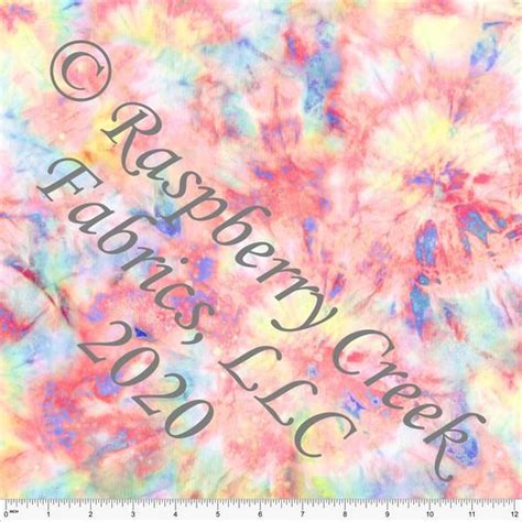 A Colorful Tie Dyed Fabric With The Words Raspberry S Club On It