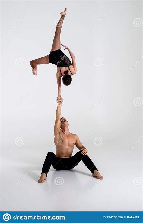 Duo Of Acrobats Showing Hand To Hand Trick Isolated On White Stock Photo Image Of Caucasian