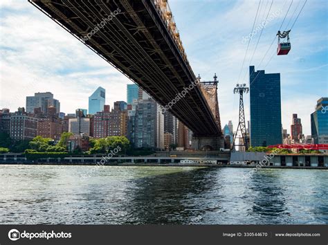 Queensboro Bridge In Midtown Manhattan With New York City Skyline Over