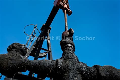An Oil Well Pumping Crude Oil Seen On The Shore Of The Maracaibo Lake