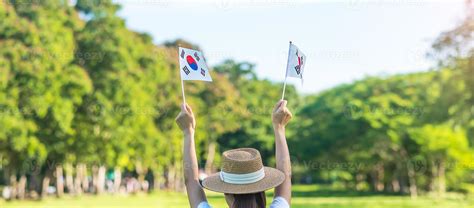 Woman Hand Holding Korea Flag On Nature Background National Foundation