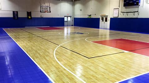 The national basketball association basketball court has different dimensions (94 by 50 feet) than the dimensions of the international basketball association which is (91.9 by 49.2 feet) dimension. Indoor Basketball Court Installation - YouTube