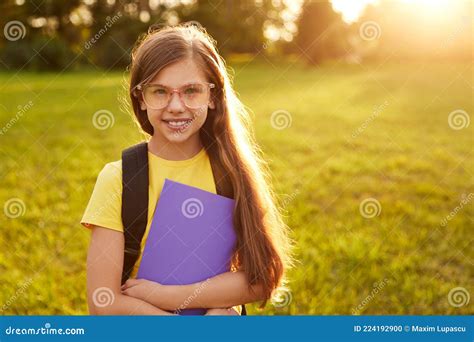 Happy Schoolgirl In Glasses Standing In Green Park Stock Photo Image