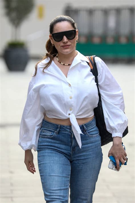 Kelly Brook Flashes A Smile And Her Midriff As She Leaves Her Heart Fm Show At The Global Radio