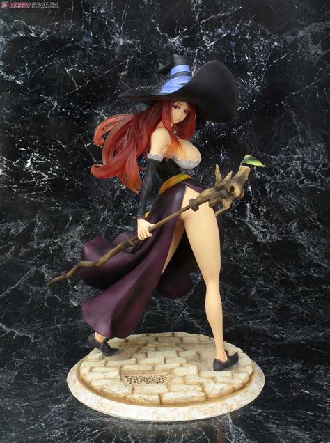 A Figurine Is Posed On A Marble Base With A Broom In Her Hand