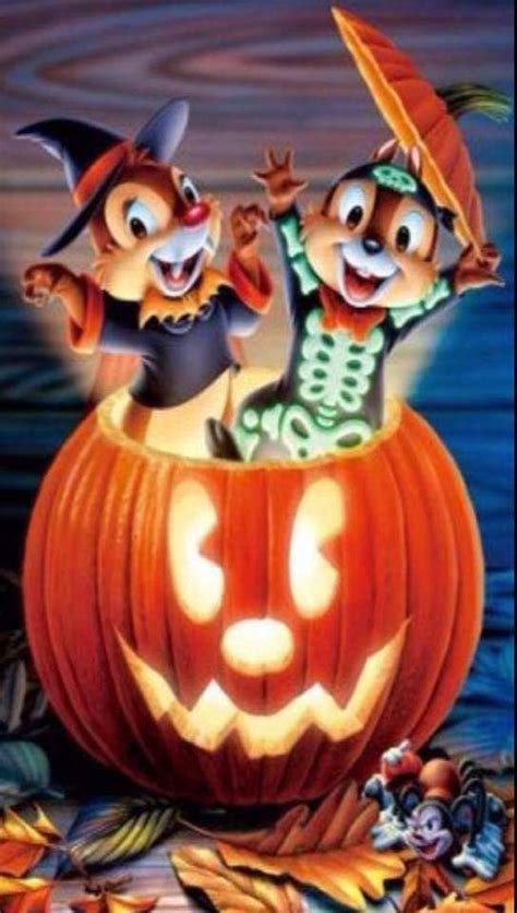 An Animated Halloween Scene With Two Cats In A Pumpkin