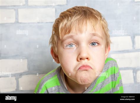 Portrait Of Adorable Sad Funny Child Stock Photo Alamy