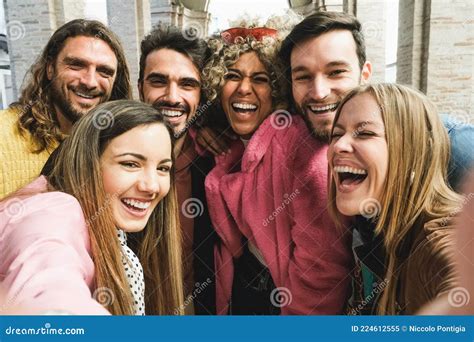 Happy Multiracial Friends Having Fun Doing Selfie Together Outdoor In City Main Focus On Black