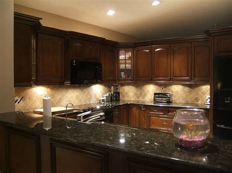 Take the kitchen above for example. Cherry Kitchen Cabinets Black Granite | Backsplash with ...