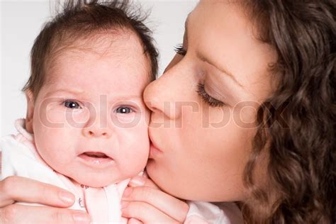 Mom Kissing Baby Stock Photo Colourbox