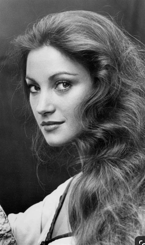 An Old Black And White Photo Of A Woman With Long Hair
