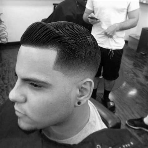 The high fade comb over is a stylish men's hairstyle that's been trending strong in recent years. Comb Over Fade Haircut For Men - 40 Masculine Hairstyles