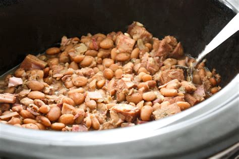 Southern pinto beans made in the slow cooker with ham hocks, onion and seasonings are rich and full of flavor. Crock Pot Pinto Beans - Daily Appetite