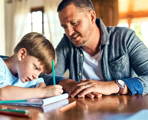 Premium Photo Dads On Standby To Help With Homework Shot Of A Father Helping His Son With His