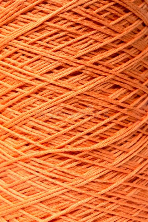 Orange Thread through Eye of Needle Stock Photo - Image of sewing ...
