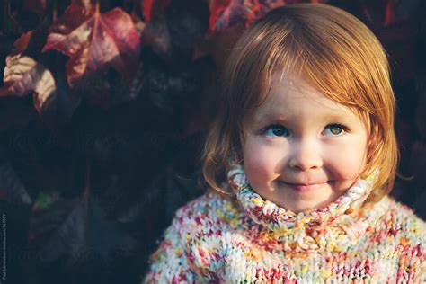 Portrait Of Cute Three Year Old Girl In Autumn By Stocksy Contributor