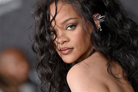 rihanna wore a sheer strapless dress and 90s blue eye shadow for a night out in miami—see pic