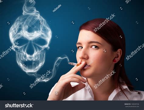 Pretty Young Woman Smoking Dangerous Cigarette Stock Photo