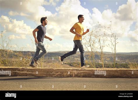 2 Men Running Outside Stock Photo Alamy