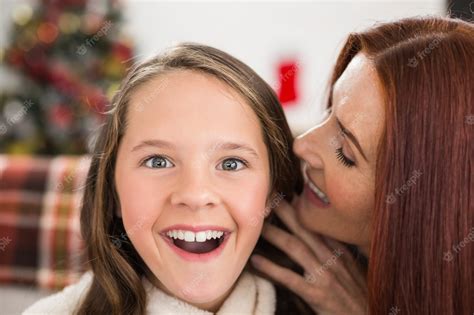 Premium Photo Mother Telling Her Daughter A Christmas Secret