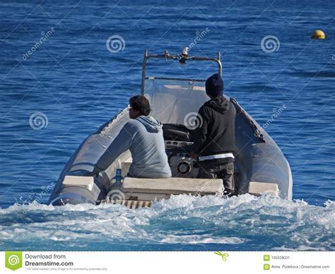 People In A Dinghy Boat Two Men In The Sea Editorial Photo Image Of