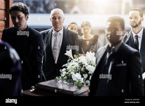 Sad Funeral And People With Coffin At Church For Service Mourning And
