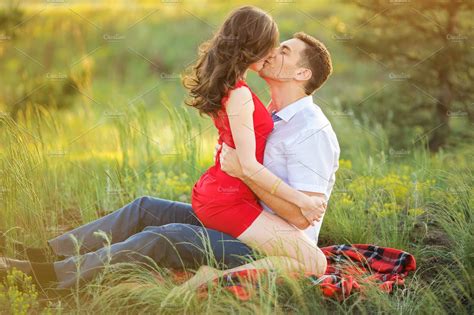 Hot Young Couple Kissing In Park ~ People Photos ~ Creative Market