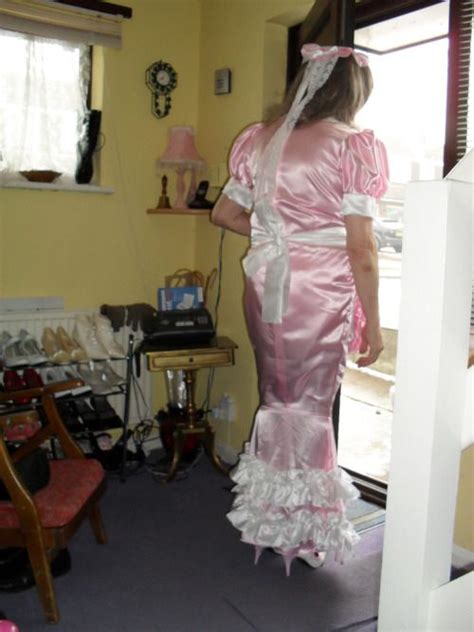 sissy spends her day in a pink hobble dress cleaning the house inside and out sissy maid