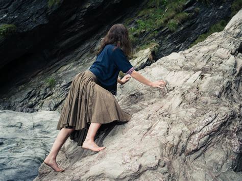 Young Barefoot Woman Climbing Rocks Stock Photo Image Of Nature
