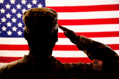 Silhouette Of Soldier Saluting The American Flag Stock Photo Download