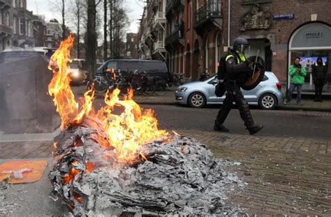 anti lockdown rioters clash with police set fires in the netherlands cbc news