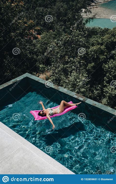 Woman In Bikini Enjoying Summer Sun In Swimming Pool Stock Image