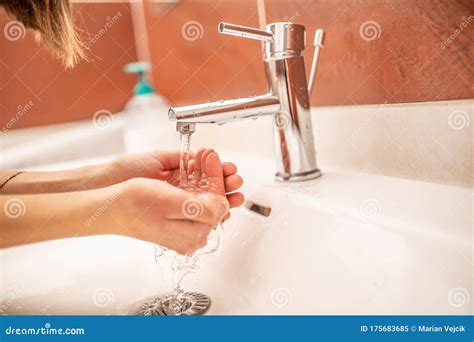 Washing Hands With Water And Liquid Soap In The Bathroom Stock Image