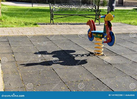 Swings And Slides In The Park For Children Playground Image Stock