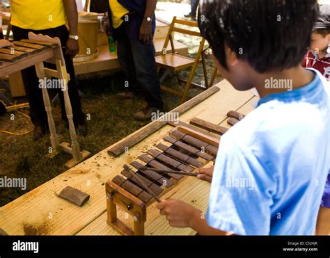 A Young Asian Boy Playing A Handmade Xylophone Stock Photo Alamy