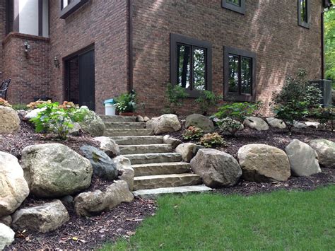 Boulder Retaining Wall And Limestone Steps For Naturalized