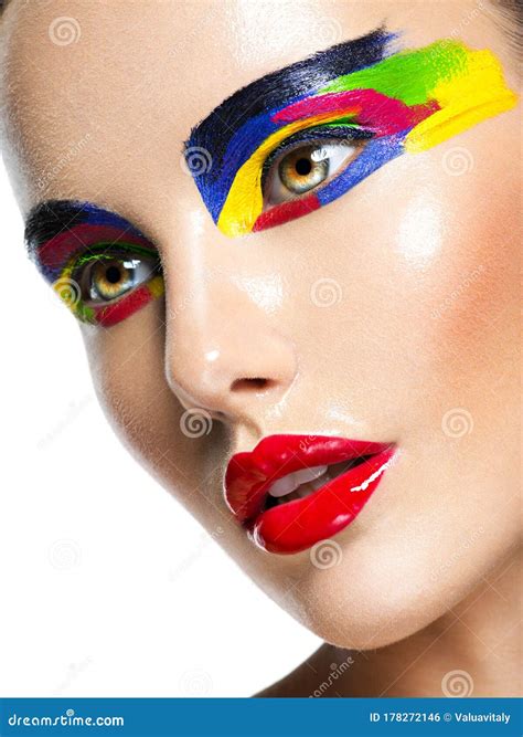 Beautiful Face Of A Woman With Multicolors Vivid Make Up Of Eyes Stock