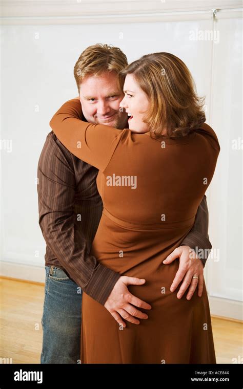 Man Groping His Wife Stock Photo Alamy