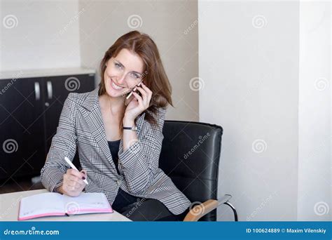 Busy Secretary Is Answering Call And Writing Memo At The Same Time Stock Image Image Of