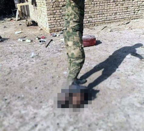 Sickening New Photos Claim To Show Iraqi Troops Torturing Isis