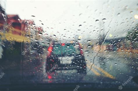 Premium Photo Road View Through Car Window With Rain Drops