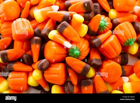Halloween Candy Corn And Pumpkins In A Pile Stock Photo Alamy