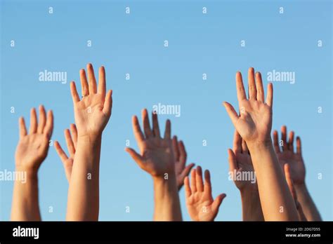 Group Of People Raising Their Hands In The Air Stock Photo Alamy