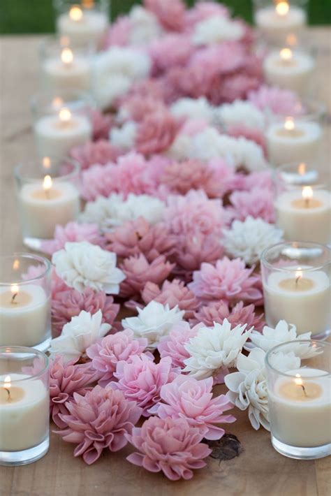 Decorate your house for christmas is such a fun project to do every year. centerpiece of pink & white flowers with candles, very ...
